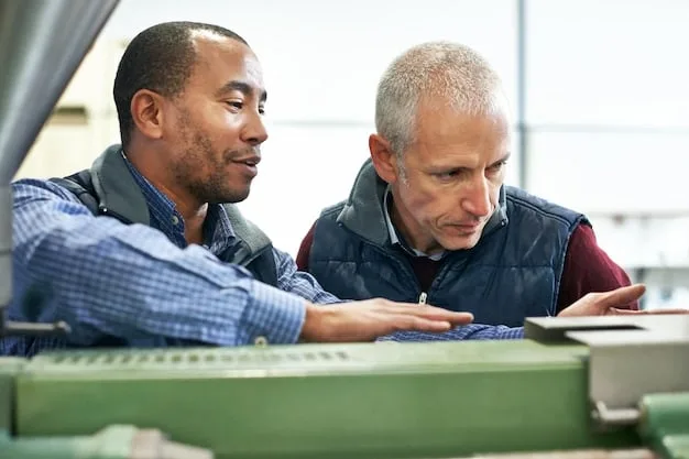 A group of US manufacturing workers participating in a training program on advanced manufacturing technologies, with an instructor demonstrating the operation of a new machine.