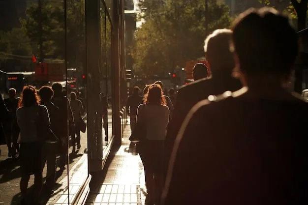 A photograph of a long line of people waiting outside a Broadway theater early in the morning, eagerly anticipating the opportunity to purchase rush tickets. The atmosphere is filled with excitement and anticipation.