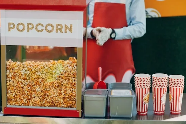 A close-up shot of a concession stand at an independent movie theater. The stand offers gourmet popcorn, craft beers, and artisanal snacks. The focus is on the quality and uniqueness of the offerings.