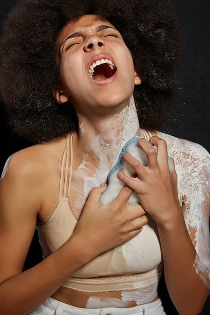 A close-up shot of a black female comedian delivering a powerful stand-up routine, bathed in soft stage lighting. Her facial expression is animated and her body language confident as she engages with the audience.