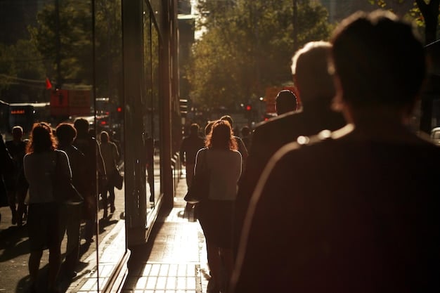 A photograph of a long line of people waiting outside a Broadway theater early in the morning, eagerly anticipating the opportunity to purchase rush tickets. The atmosphere is filled with excitement and anticipation.