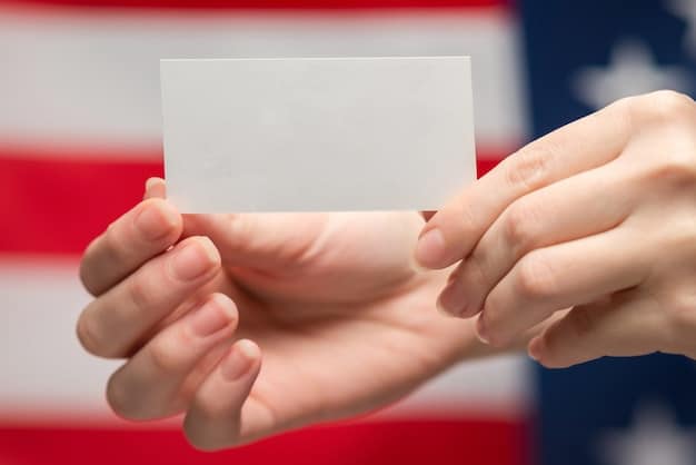 A close-up of a person's hand placing a ballot into a voting box, with a blurred American flag in the background, symbolizing the act of voting and expressing public opinion.